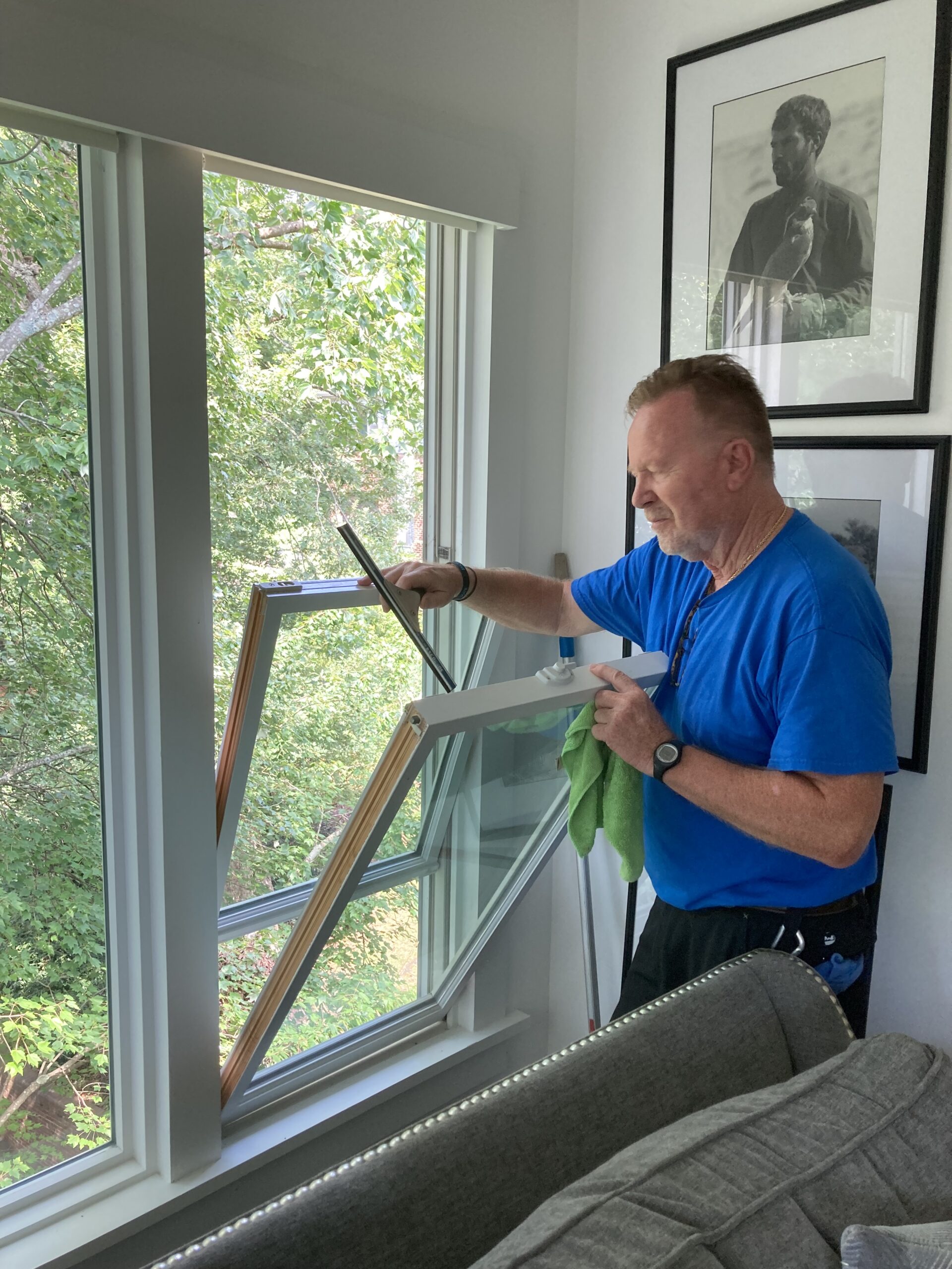 Clean Avenue technician cleaning the interior of a residential window
